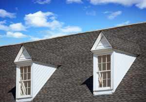 Roof Replacement Pewaukee WI Grey shingled roof with two windows