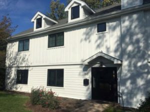Siding Contractors Waukesha WI White home lined with black windows