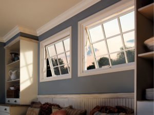 Open awning window showing view of sky and trees 